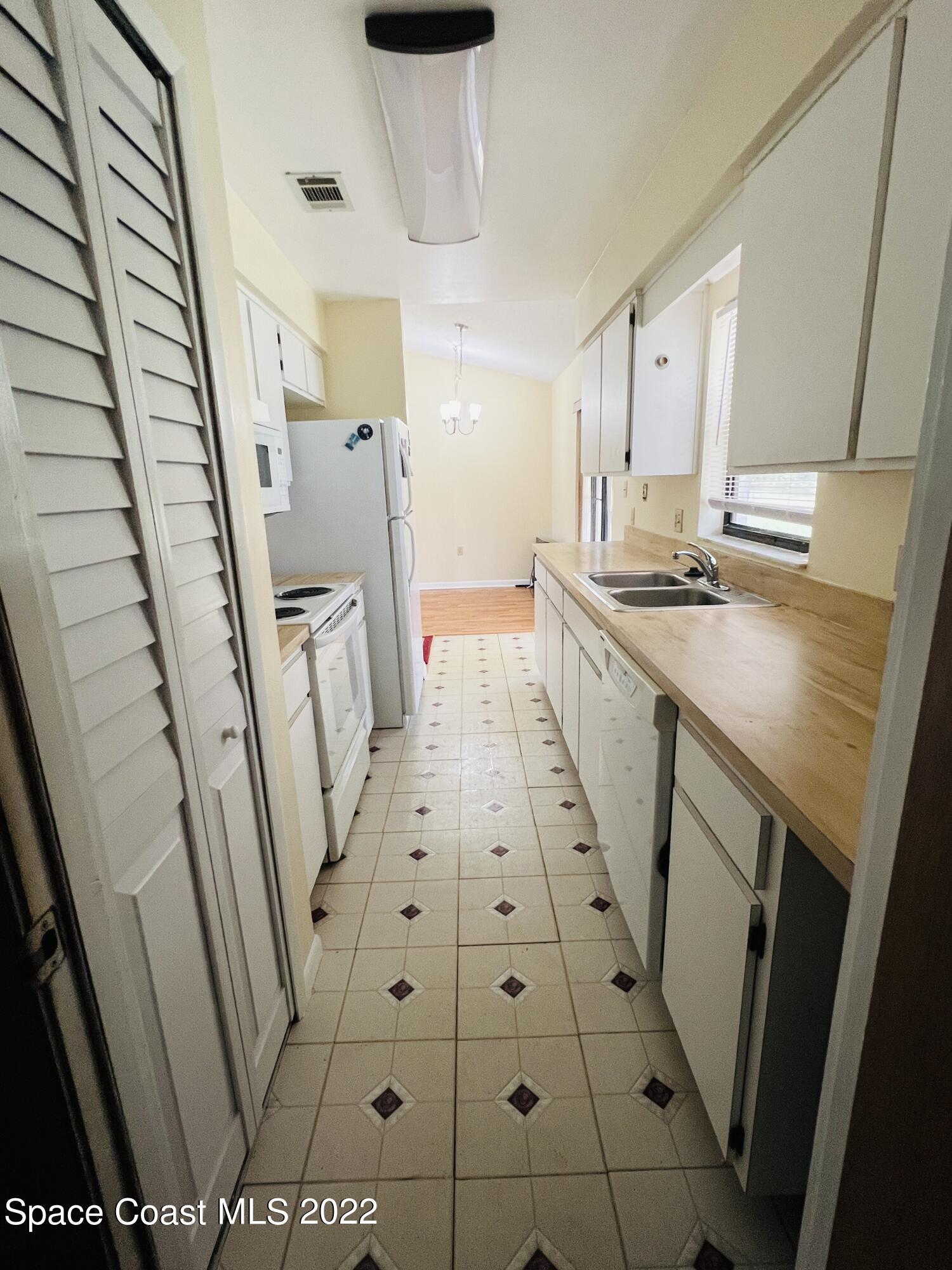 4897 Bridge Road Cocoa, FL 32927 - Photo 5 of 12 a bathroom with sink shower and a mirror