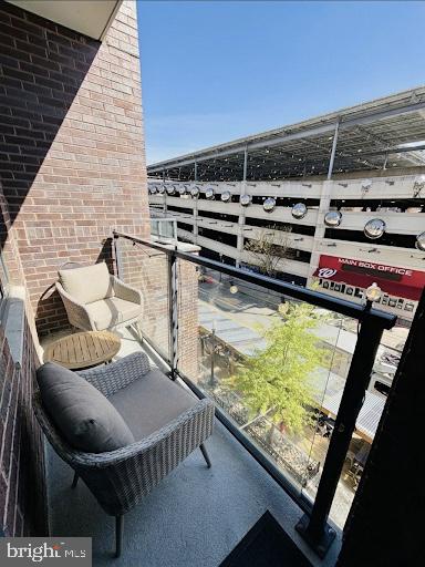 70 N Street Southeast, Unit N301 Washington, DC 20003 - Photo 19 of 47 a balcony with table and chairs