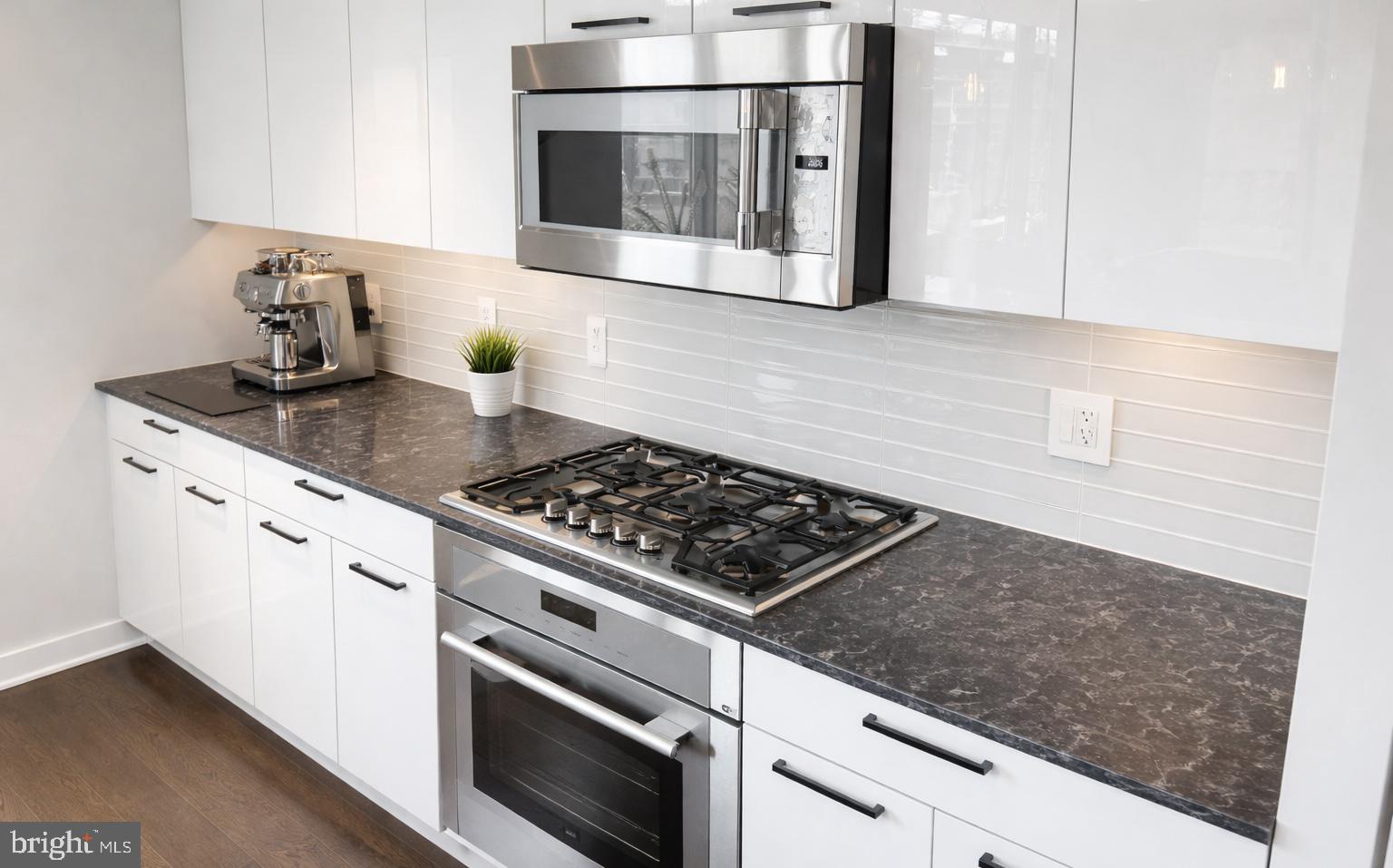70 N Street Southeast, Unit N301 Washington, DC 20003 - Photo 5 of 47 a stove top oven sitting inside of a kitchen