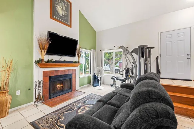 a dining room with furniture and window