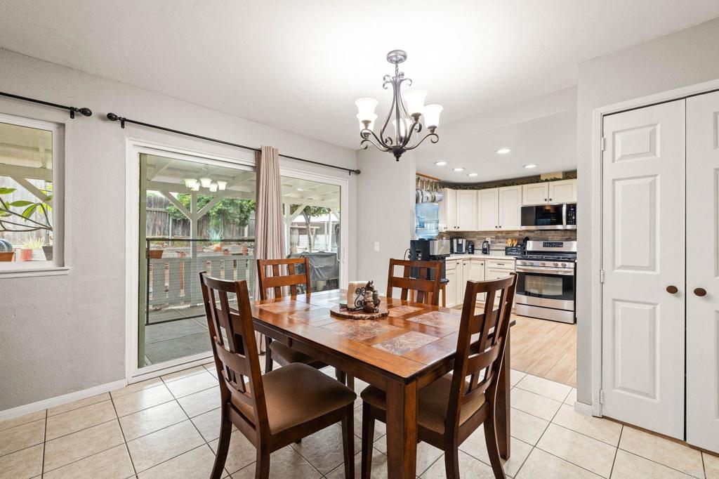 9690 Bundy Drive Santee, CA 92071 - Photo 23 of 66 a view of a dining room with furniture window and outside view