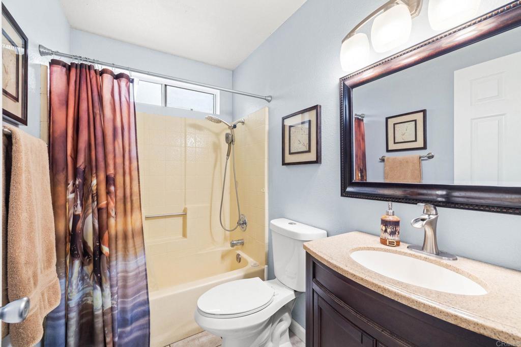9690 Bundy Drive Santee, CA 92071 - Photo 27 of 66 a bathroom with a sink a toilet and shower