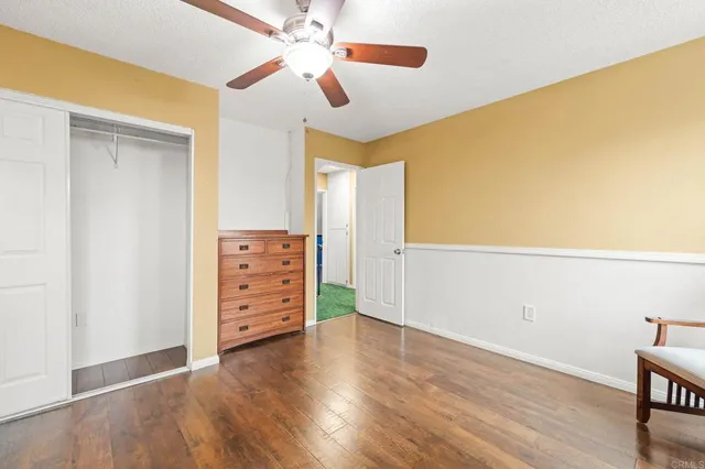 a bathroom with a toilet a sink and a mirror