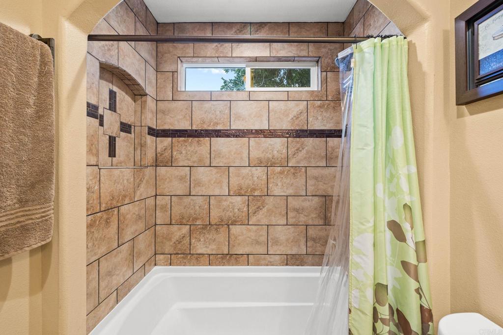 9690 Bundy Drive Santee, CA 92071 - Photo 33 of 66 a bathroom with a bathtub and shower