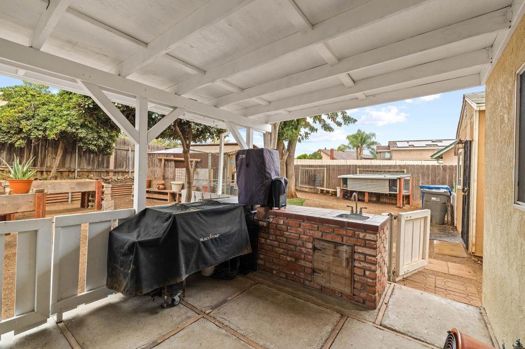 9690 Bundy Drive Santee, CA 92071 - Photo 60 of 66 a kitchen with stainless steel appliances granite countertop a stove and a refrigerator