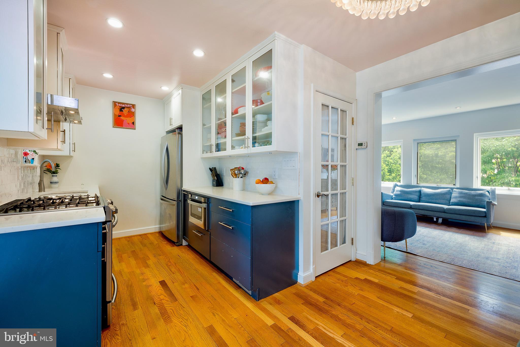 2135 Tunlaw Road Northwest Washington, DC 20007 - Photo 12 of 48 a bedroom with a bed and a dresser