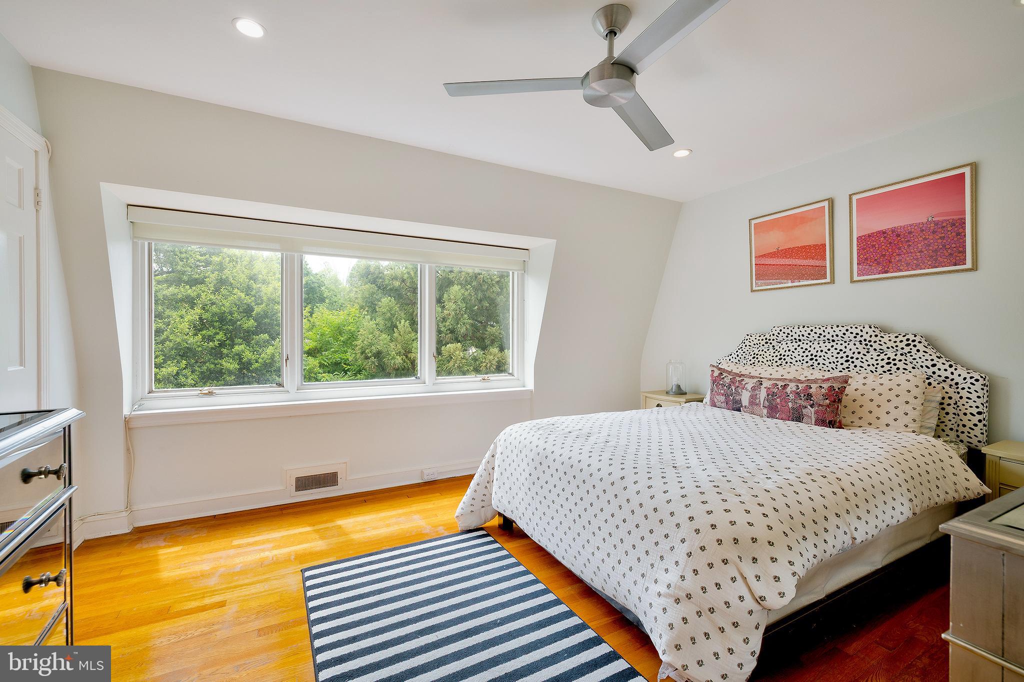 2135 Tunlaw Road Northwest Washington, DC 20007 - Photo 25 of 48 a bedroom with a bed and window