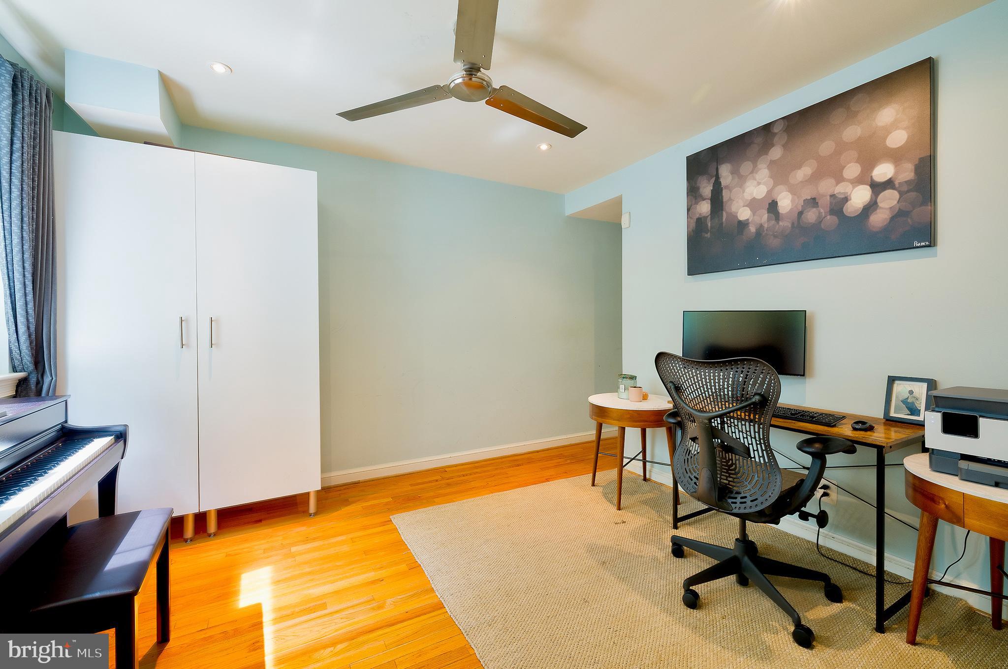 2135 Tunlaw Road Northwest Washington, DC 20007 - Photo 32 of 48 a workspace with furniture and a rug