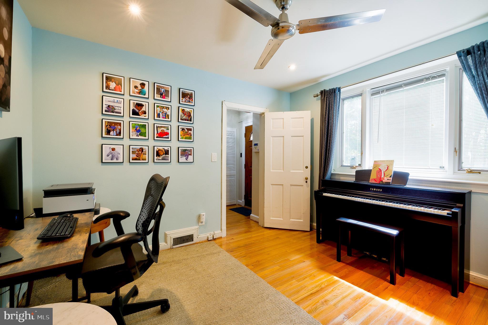 2135 Tunlaw Road Northwest Washington, DC 20007 - Photo 34 of 48 a view of a workspace with furniture and a window