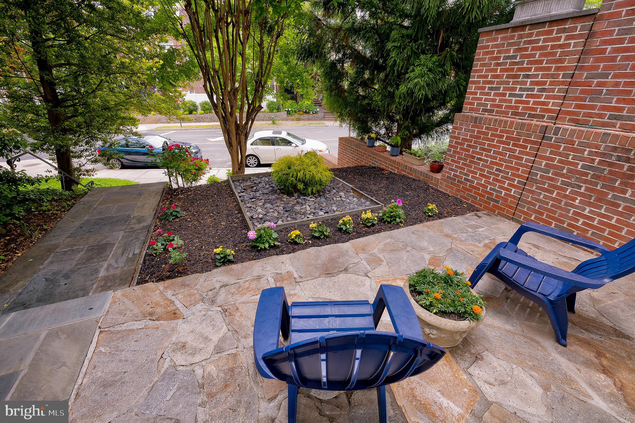 2135 Tunlaw Road Northwest Washington, DC 20007 - Photo 39 of 48 a view of a chairs and table in backyard