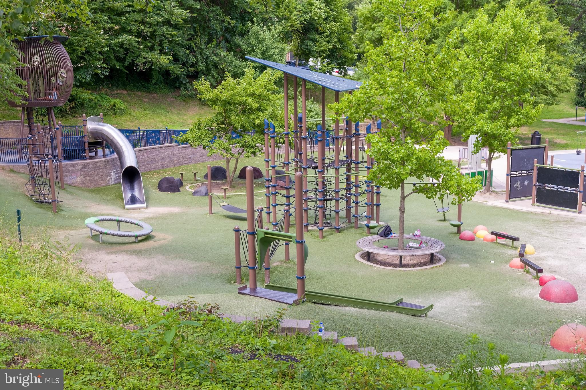2135 Tunlaw Road Northwest Washington, DC 20007 - Photo 43 of 48 a view of a backyard with table and chairs potted plants