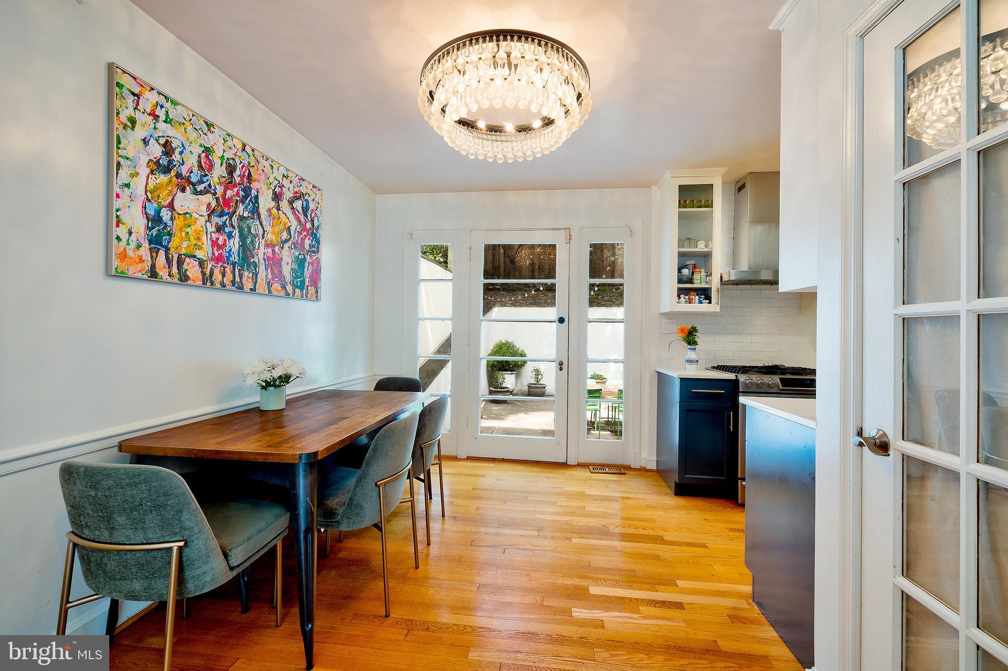 2135 Tunlaw Road Northwest Washington, DC 20007 - Photo 9 of 48 a workspace with furniture and wooden floor