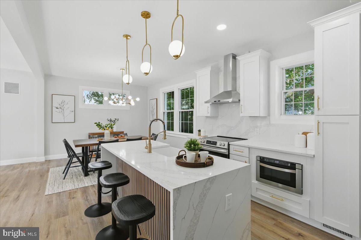 1705 Corwin Drive Silver Spring, MD 20910 - Photo 11 of 38 a kitchen with a table and chairs in it
