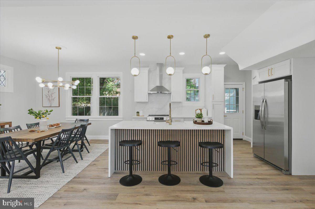 1705 Corwin Drive Silver Spring, MD 20910 - Photo 12 of 38 a dining table chairs and a chandelier