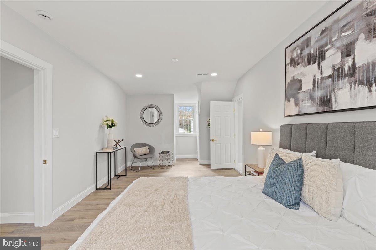 1705 Corwin Drive Silver Spring, MD 20910 - Photo 17 of 38 a bedroom with furniture and a large mirror