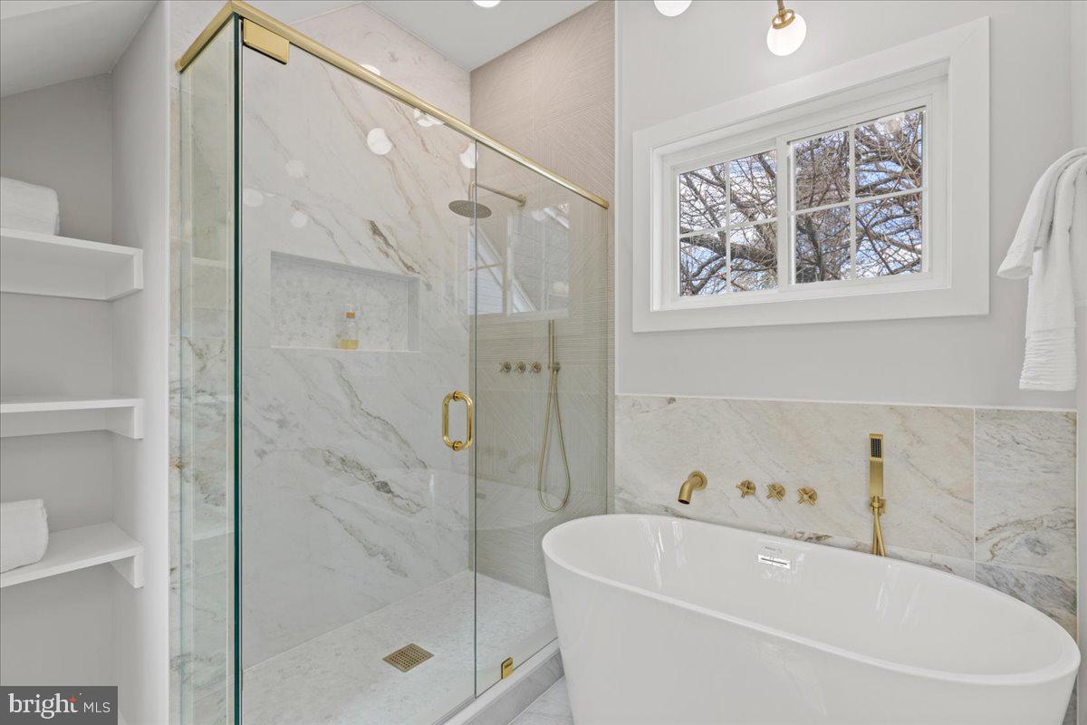 1705 Corwin Drive Silver Spring, MD 20910 - Photo 20 of 38 a white bath tub sitting next to a white sink and a shower