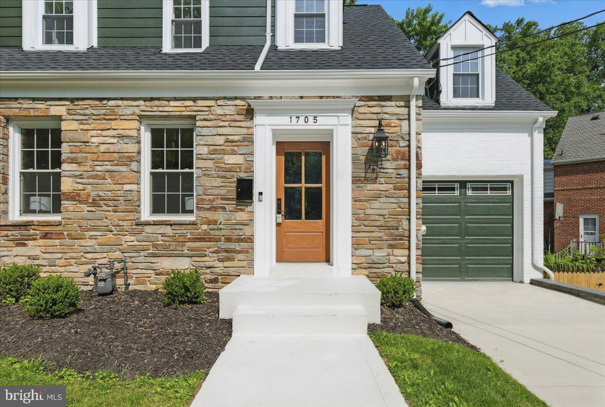 1705 Corwin Drive Silver Spring, MD 20910 - Photo 2 of 38 a front view of a house with a garden