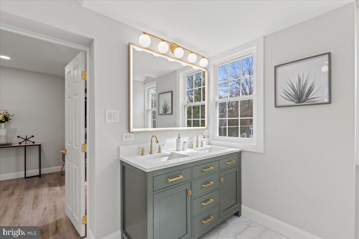 1705 Corwin Drive Silver Spring, MD 20910 - Photo 22 of 38 a en suite bathroom with a granite countertop sink mirror and