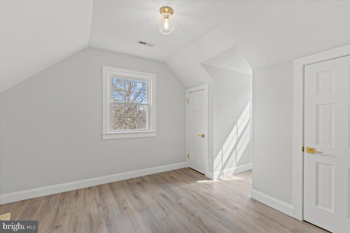 1705 Corwin Drive Silver Spring, MD 20910 - Photo 23 of 38 wooden floor in an empty room with a window
