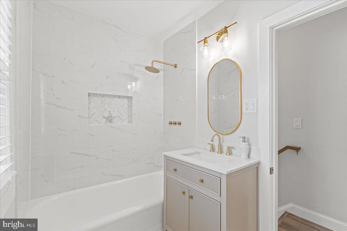 1705 Corwin Drive Silver Spring, MD 20910 - Photo 26 of 38 a bathroom with a sink mirror and a bathtub