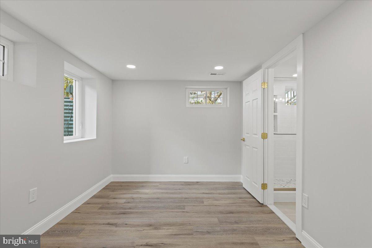 1705 Corwin Drive Silver Spring, MD 20910 - Photo 30 of 38 wooden floor in an empty room with a window