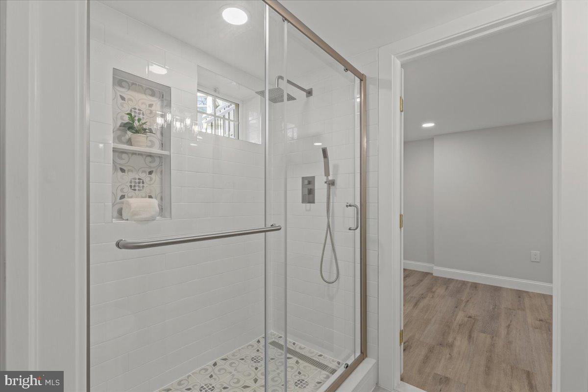 1705 Corwin Drive Silver Spring, MD 20910 - Photo 32 of 38 a bathroom with a glass shower door