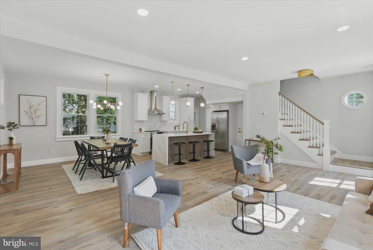 1705 Corwin Drive Silver Spring, MD 20910 - Photo 6 of 38 a living room with furniture kitchen view and a wooden floor