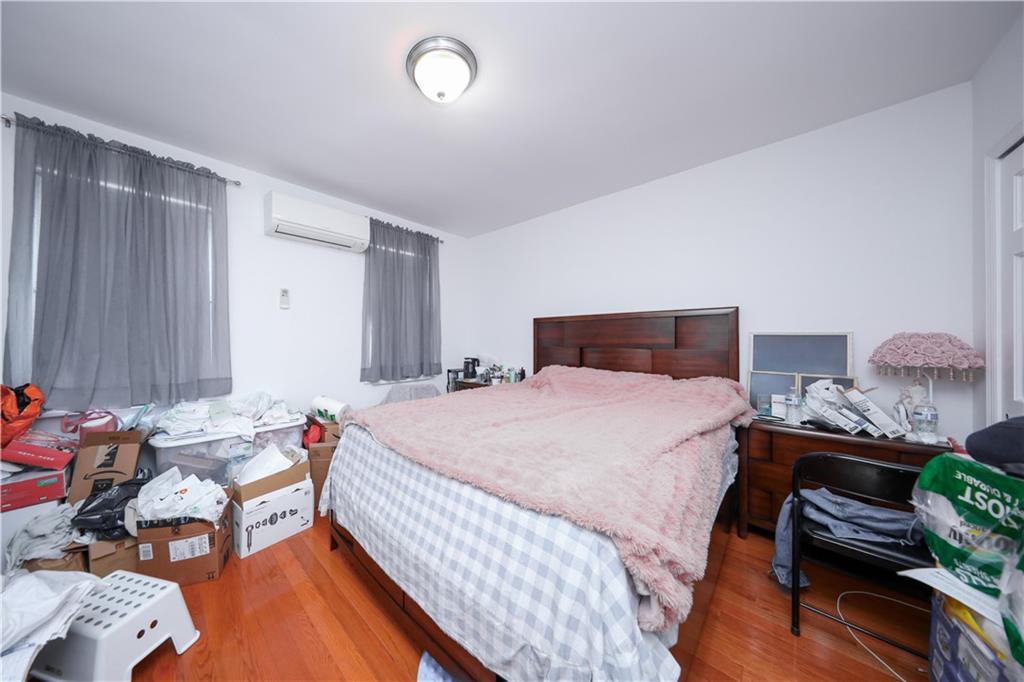 2046 Stuart Street Brooklyn, NY 11229 - Photo 12 of 27 a bedroom with bed and a window