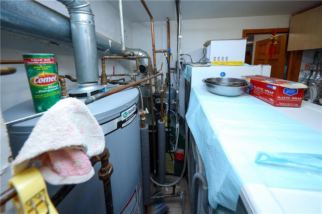 2046 Stuart Street Brooklyn, NY 11229 - Photo 19 of 27 a utility room with dryer and washer