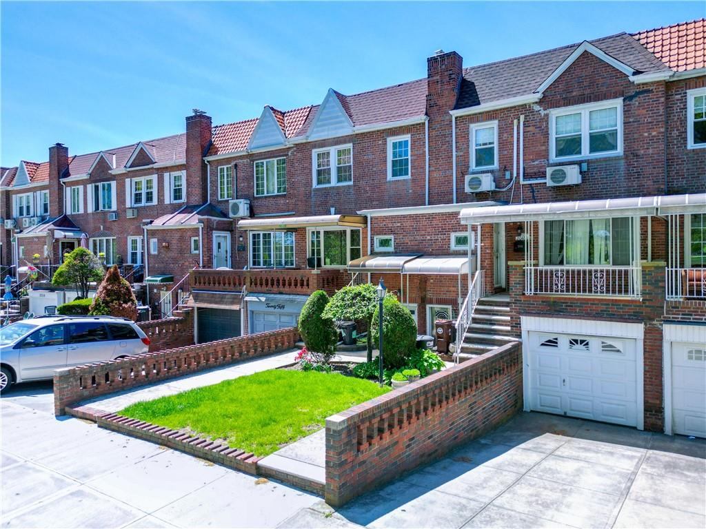 2046 Stuart Street Brooklyn, NY 11229 - Photo 21 of 27 a front view of a house with garden
