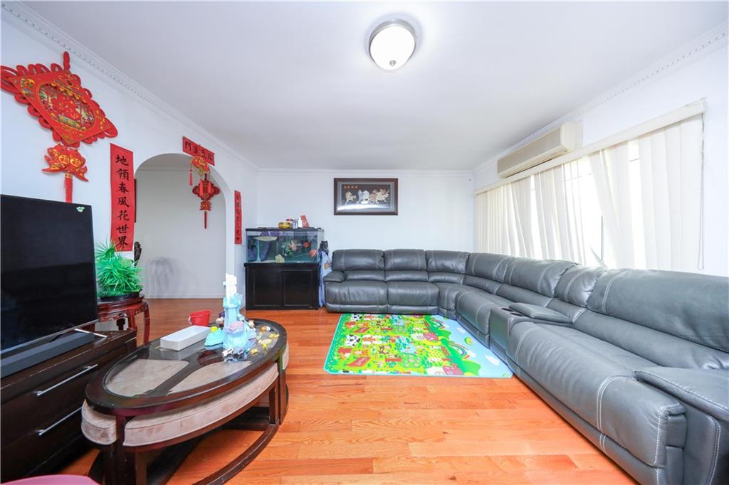 2046 Stuart Street Brooklyn, NY 11229 - Photo 6 of 27 a living room with furniture and a flat screen tv