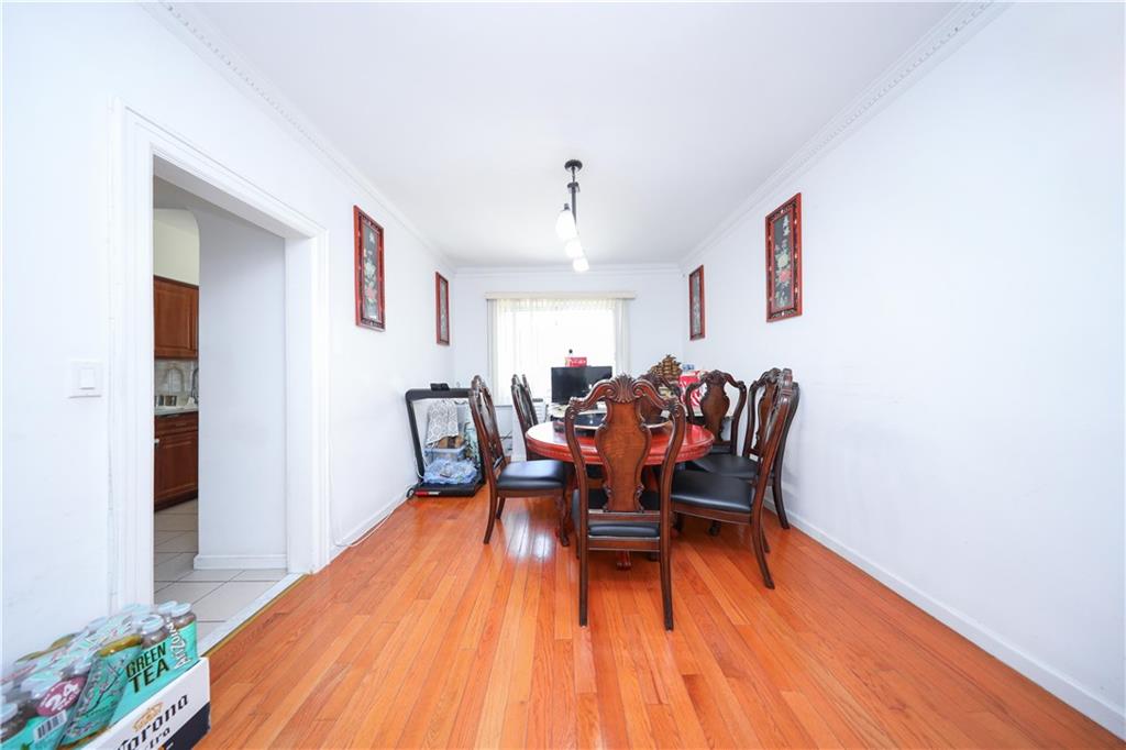 2046 Stuart Street Brooklyn, NY 11229 - Photo 9 of 27 a dining room with furniture and wooden floor