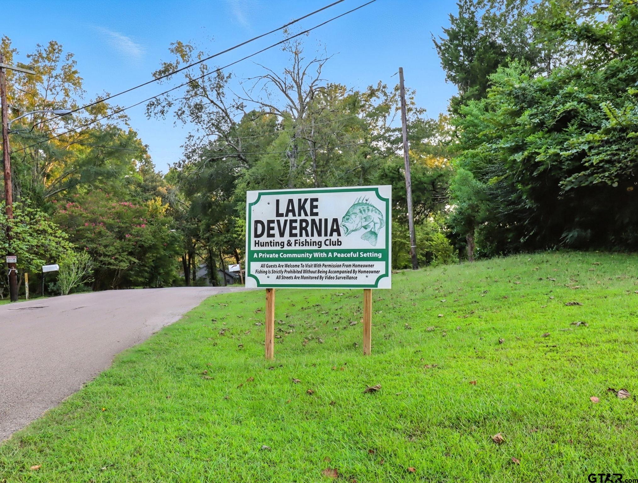 402 Watson Road Gladewater, TX 75647 - Photo 29 of 32 a sign broad in front of a tree