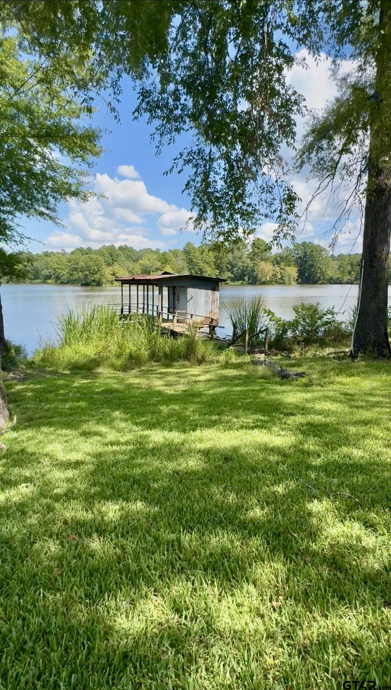 402 Watson Road Gladewater, TX 75647 - Photo 31 of 32 a view of lawn chairs and deck