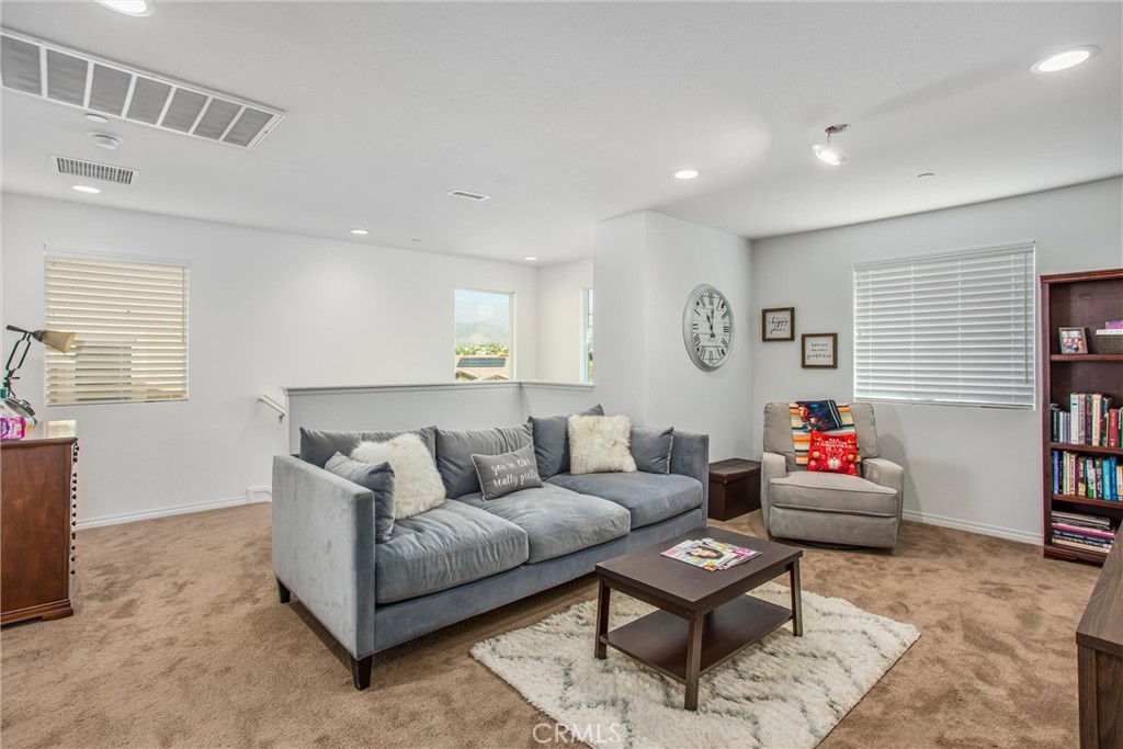 14019 Dandolo Lane Beaumont, CA 92223 - Photo 17 of 34 a living room with furniture and wooden floor