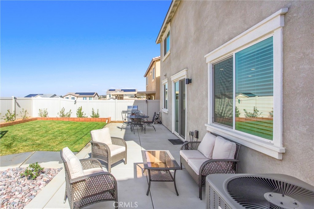 14019 Dandolo Lane Beaumont, CA 92223 - Photo 26 of 34 a building outdoor space with patio furniture
