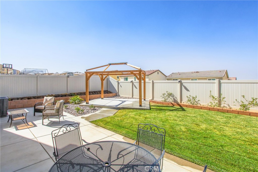 14019 Dandolo Lane Beaumont, CA 92223 - Photo 27 of 34 a swimming pool with outdoor seating