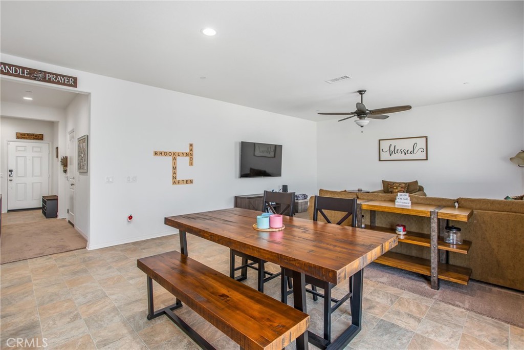 14019 Dandolo Lane Beaumont, CA 92223 - Photo 7 of 34 a living room with furniture pool table and a flat screen tv
