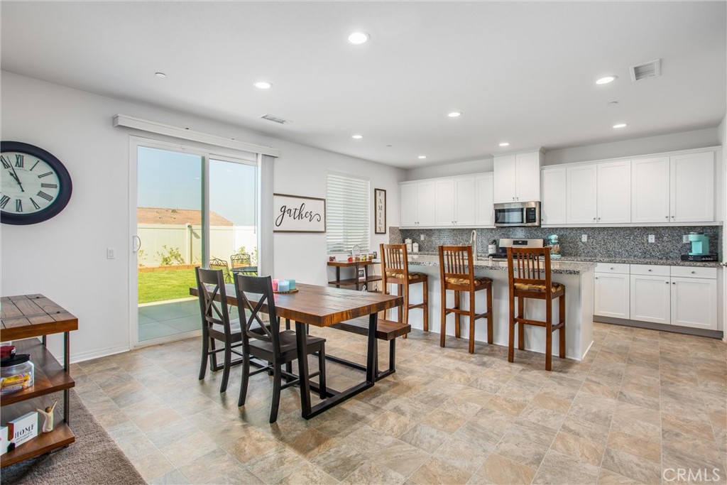 14019 Dandolo Lane Beaumont, CA 92223 - Photo 8 of 34 a view of a dining area with furniture window and wooden floor