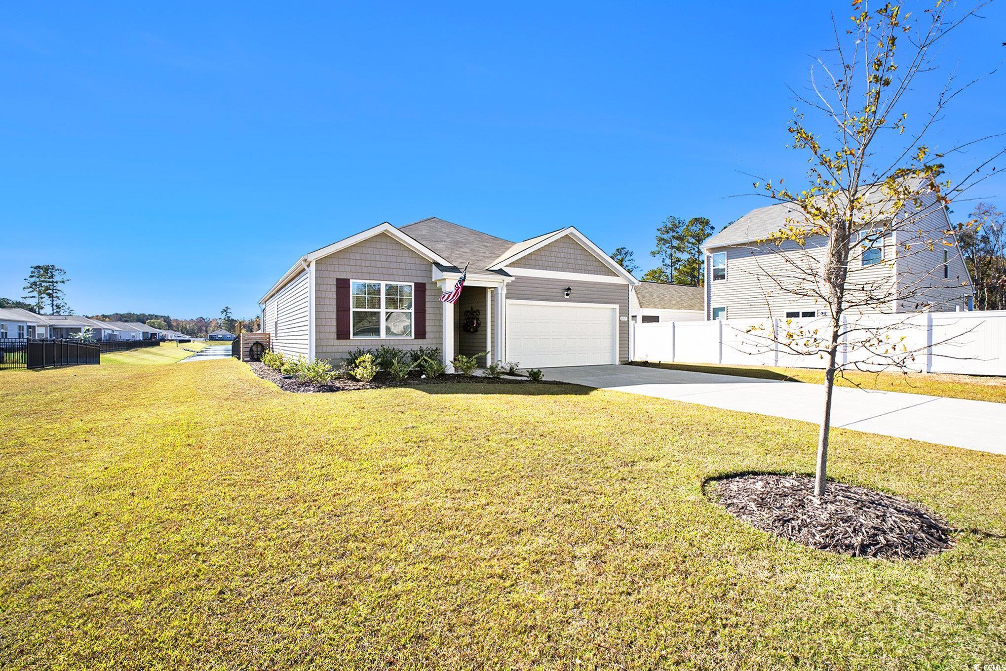 409 Samara Drive Longs, SC 29568 - Photo 4 of 40 View of front of home featuring driveway and an attached garage