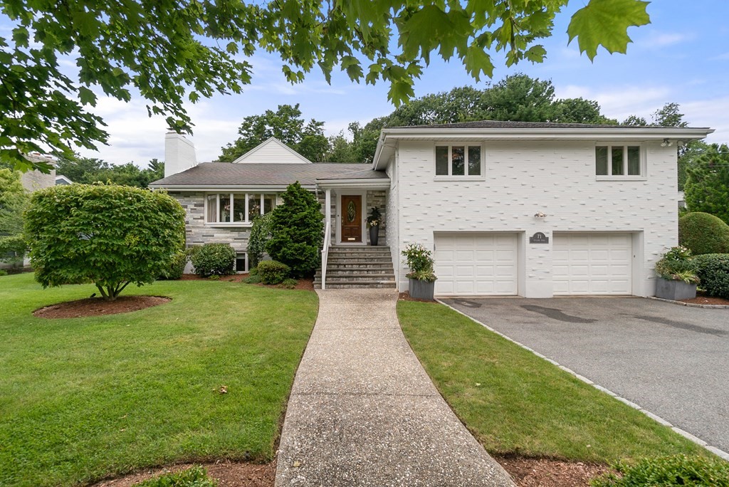 a front view of a house with garden