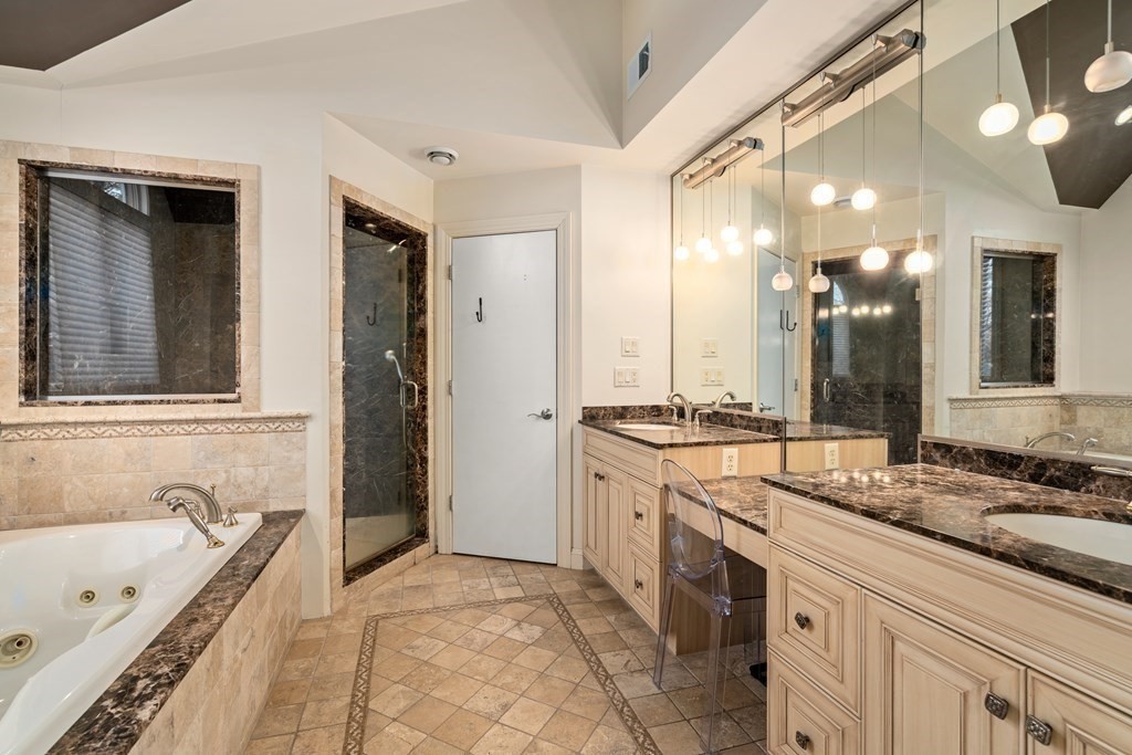 71 Sevland Road Newton, MA 02459 - Photo 14 of 28 a spacious bathroom with a tub sink shower and mirror
