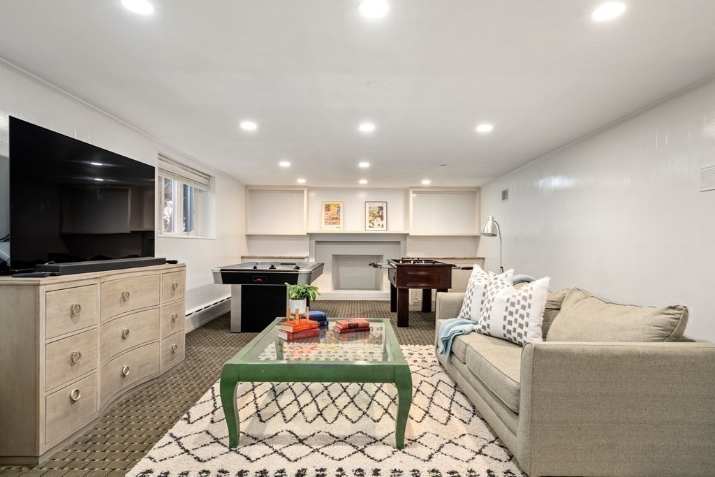 71 Sevland Road Newton, MA 02459 - Photo 18 of 28 a living room with furniture and a flat screen tv