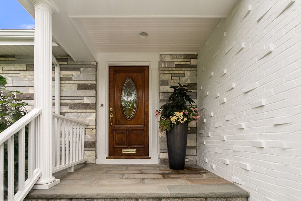 71 Sevland Road Newton, MA 02459 - Photo 2 of 28 a front view of a house with a potted plant
