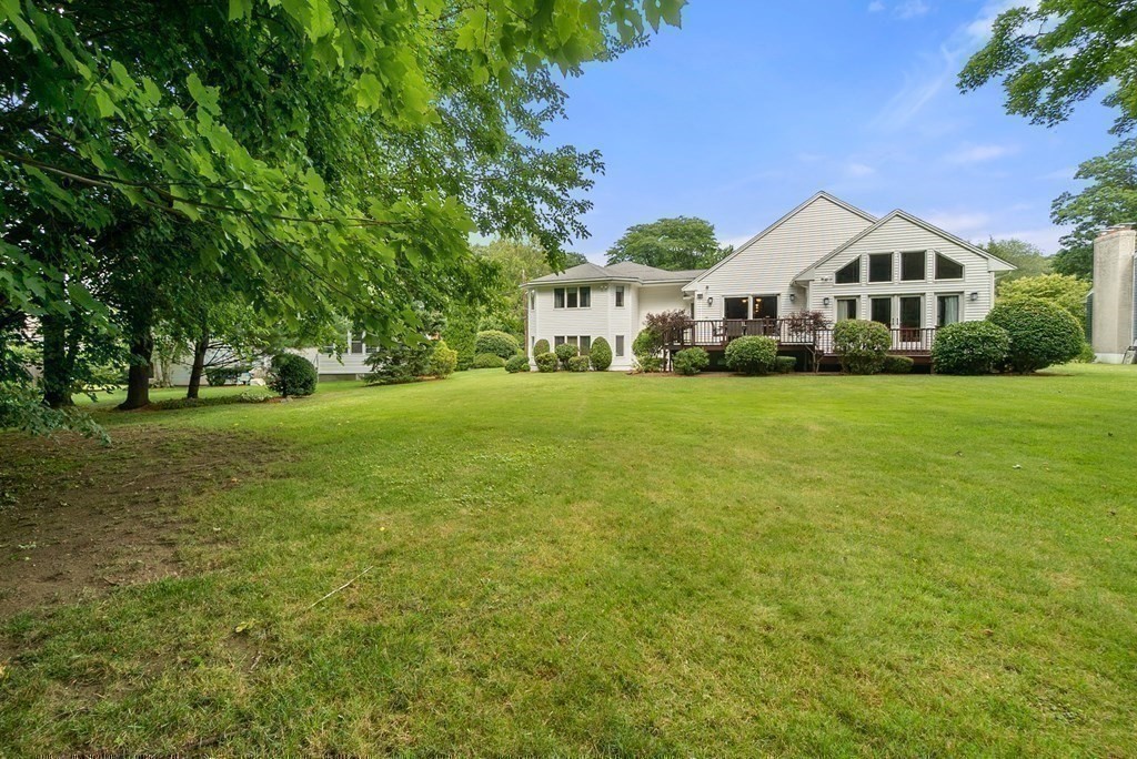 71 Sevland Road Newton, MA 02459 - Photo 25 of 28 a front view of a house with a yard