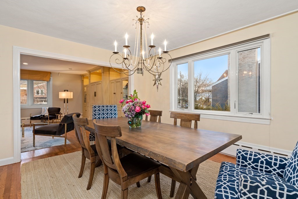 71 Sevland Road Newton, MA 02459 - Photo 7 of 28 a dining room with furniture a chandelier and window