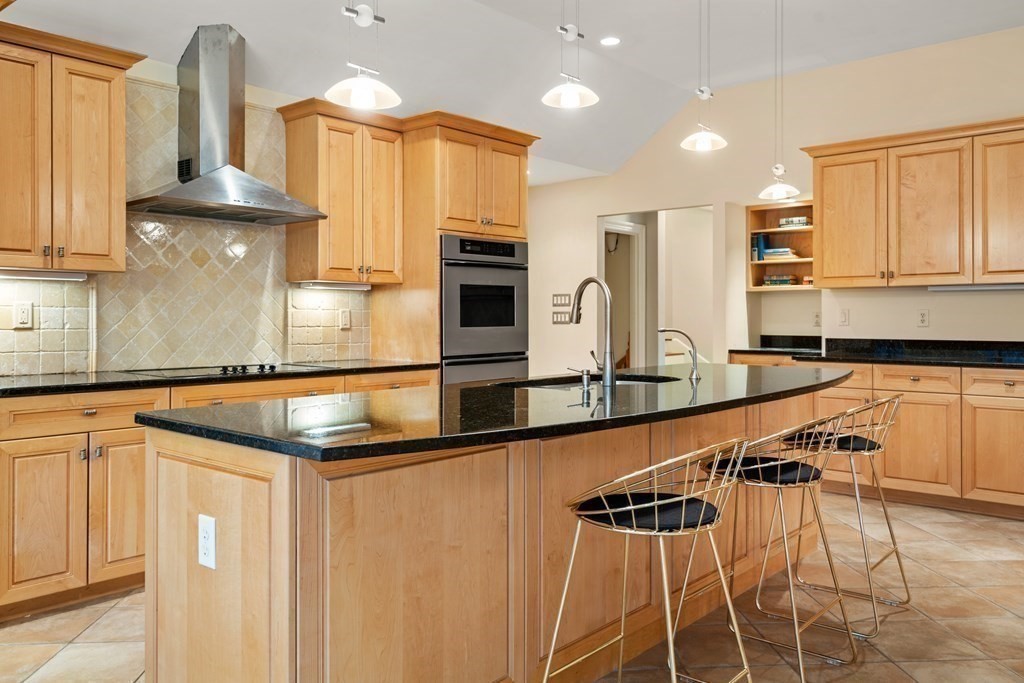 71 Sevland Road Newton, MA 02459 - Photo 9 of 28 a kitchen with stainless steel appliances granite countertop a sink and a counter space
