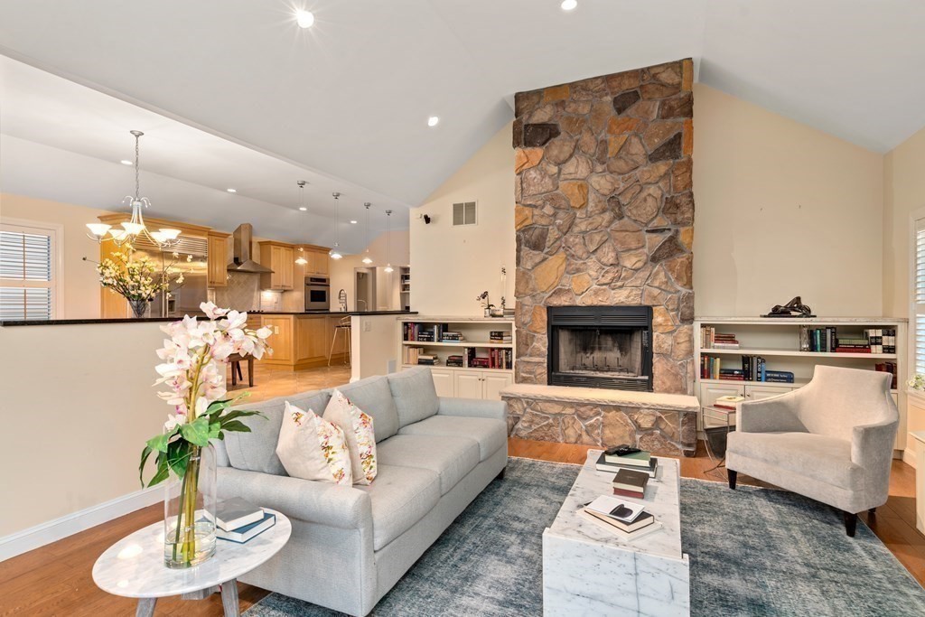 71 Sevland Road Newton, MA 02459 - Photo 10 of 28 a living room with furniture kitchen view and a fireplace