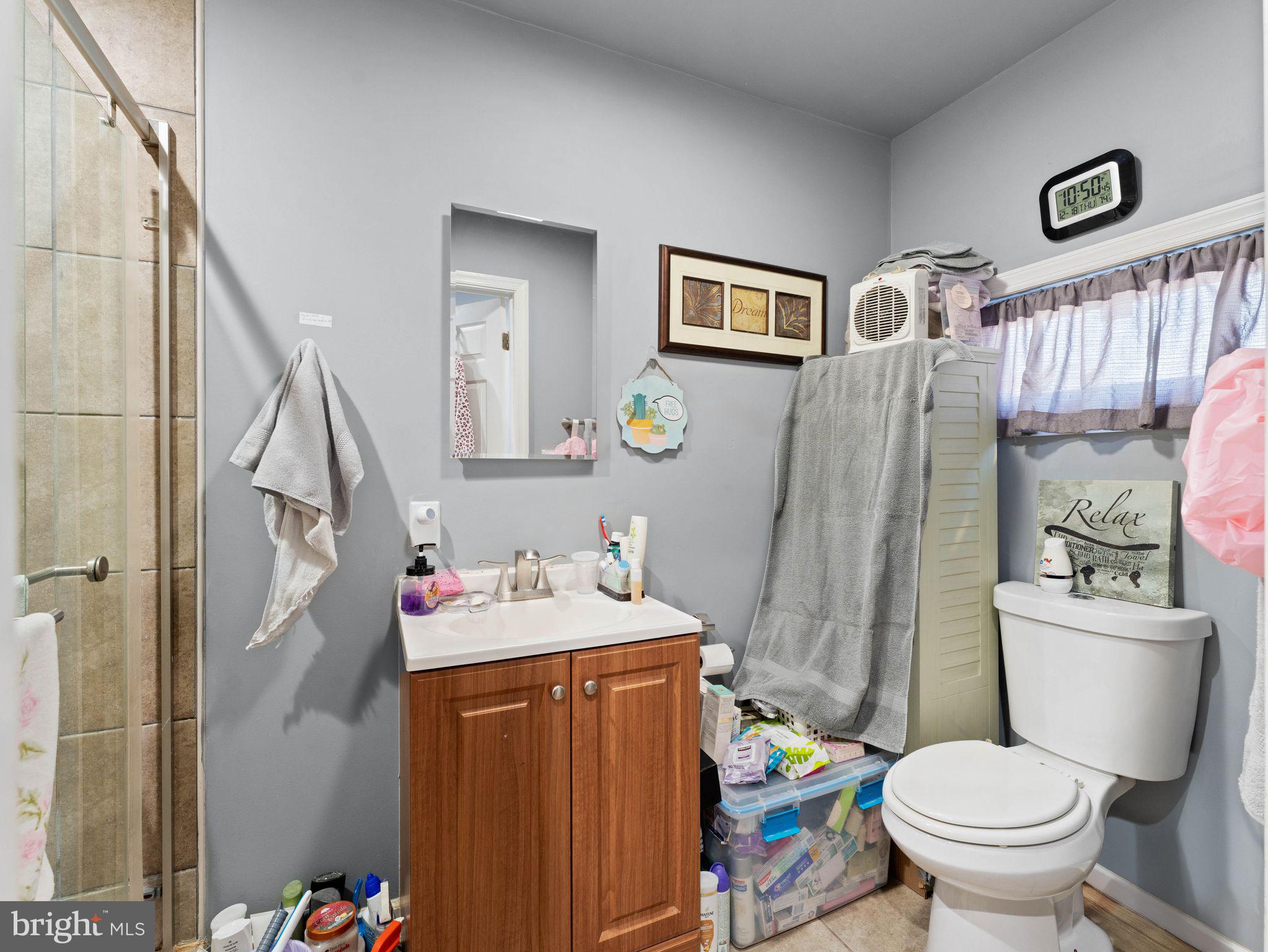 435 Mechanic Street Camden, NJ 08104 - Photo 11 of 16 a bathroom with a sink toilet and shower