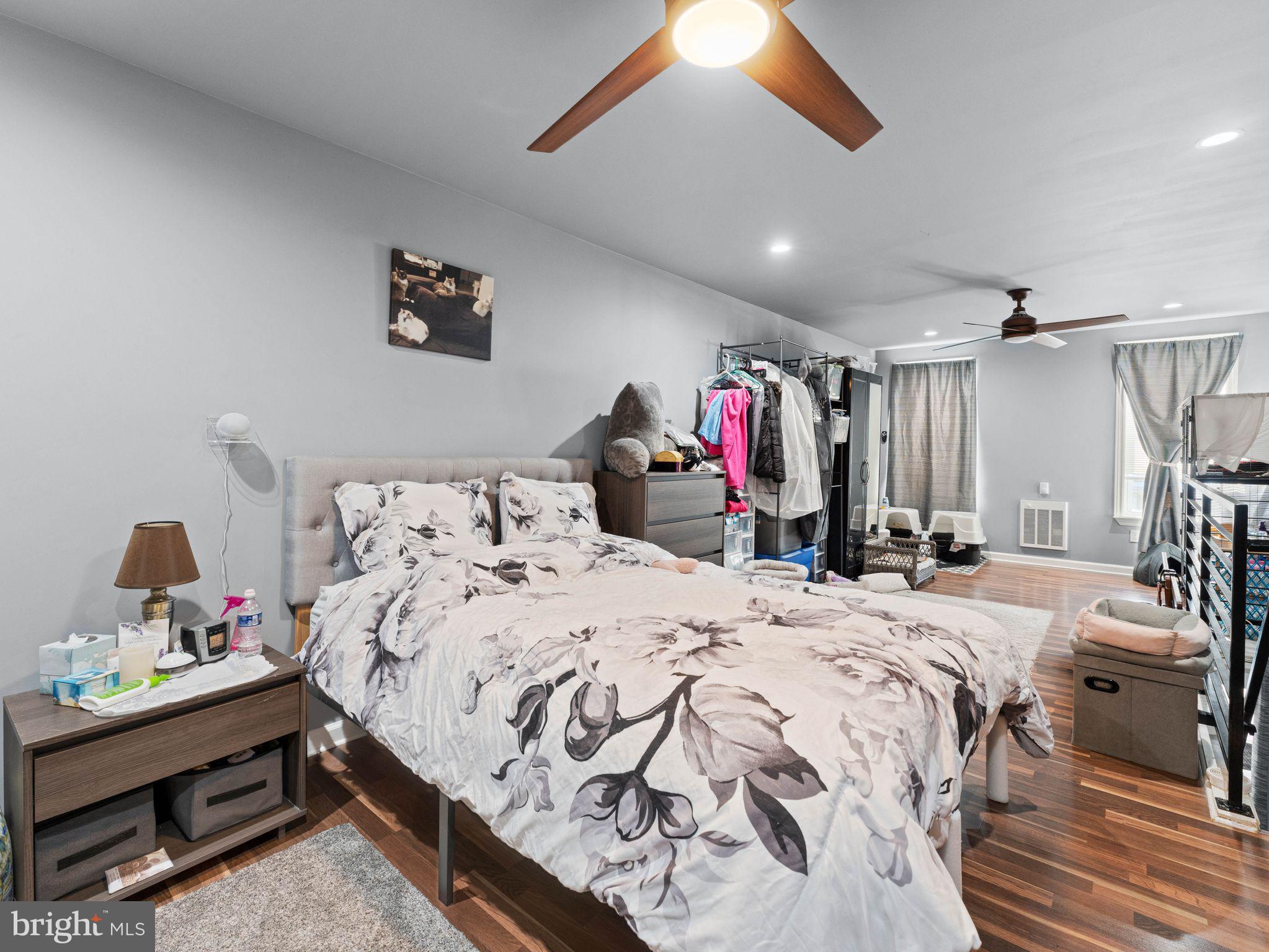 435 Mechanic Street Camden, NJ 08104 - Photo 15 of 16 a bedroom with a bed and a chandelier